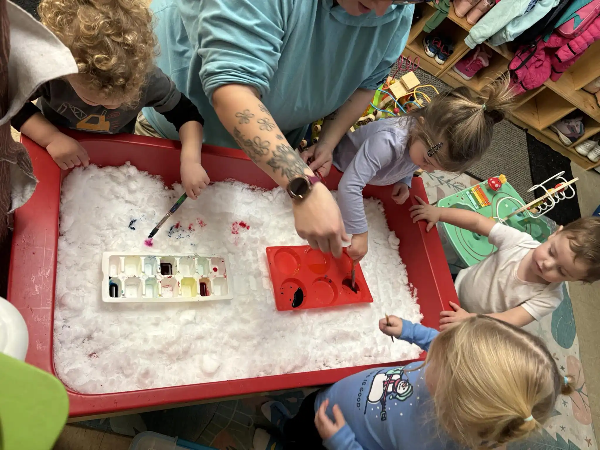 Toddlers exploring and playing together in Hurney's bright, safe toddler room