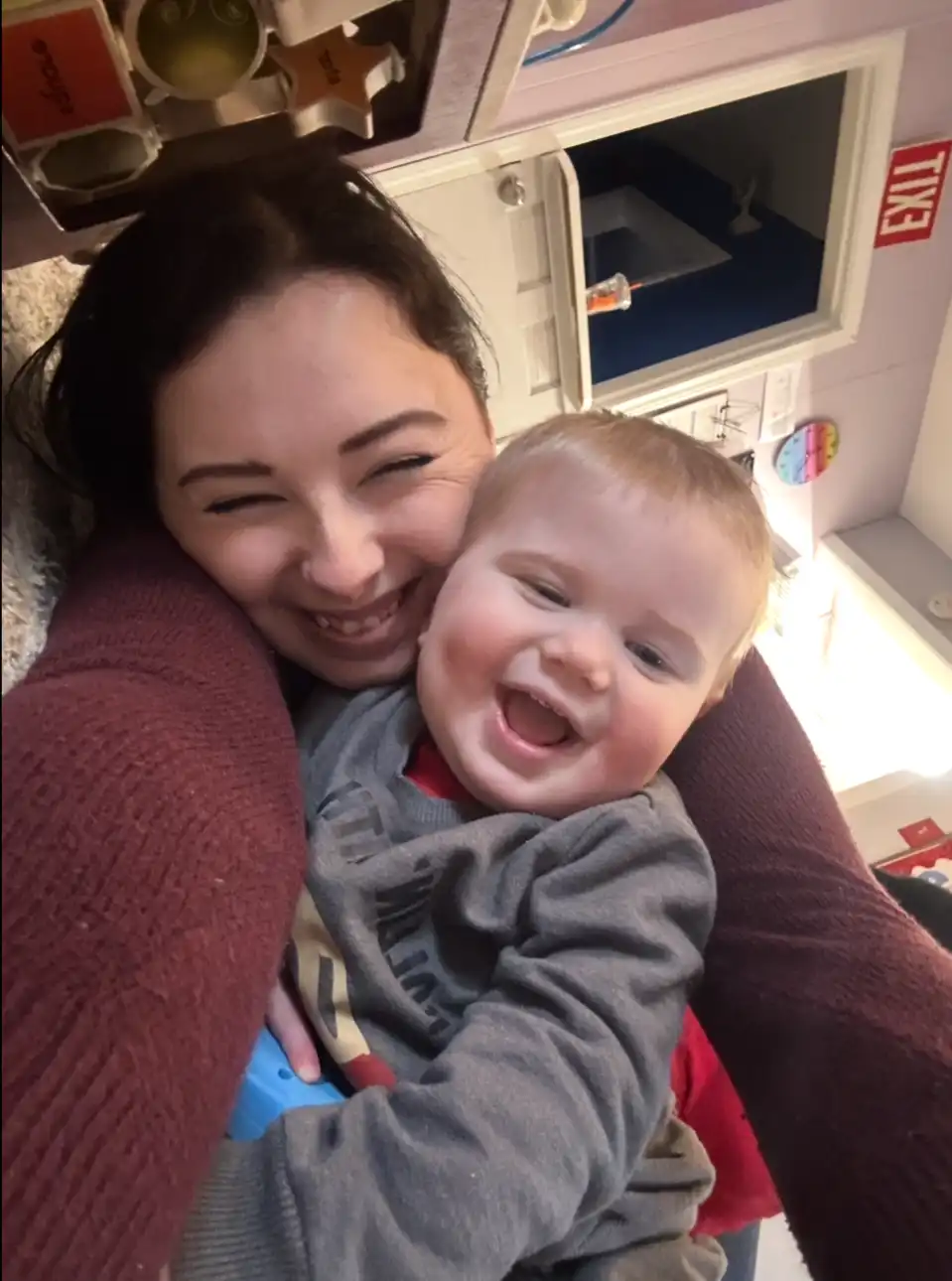 Caregiver with a happy toddler